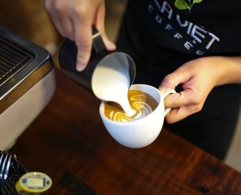 Barista makes coffee